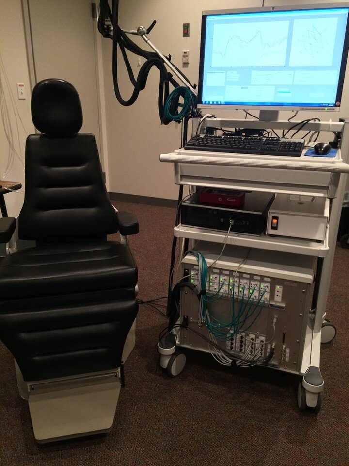 lab chair with computer screen and instruments